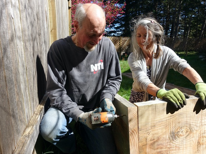 Gary & Michelle fastening box sides. Don't forget to add angle brackets on the corners! -Will Thomas photo