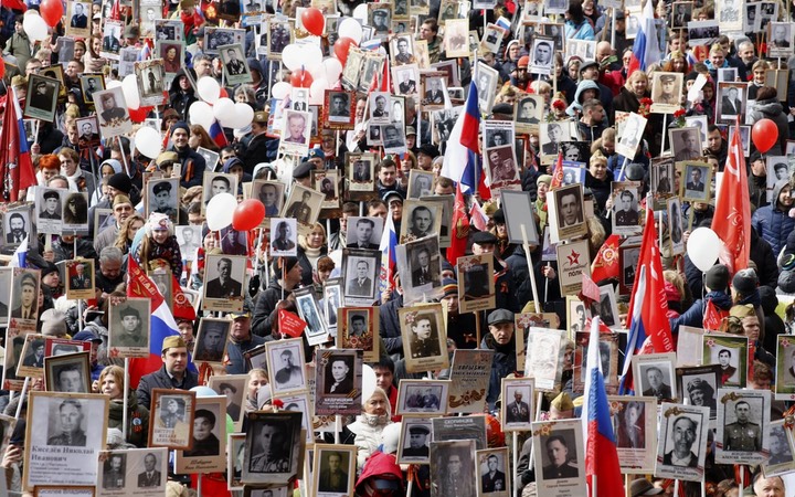 Russian citizens carry portraits of their relatives who fell in the Great Patriotic War during annual Victory Day commemorations -telegraph.co.uk